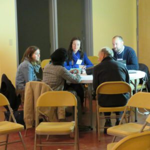 People talking around a round table