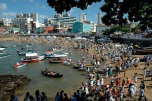 people gathered on a beach shore